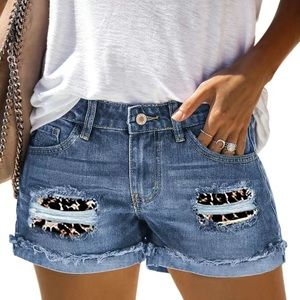 Cute denim shorts with leopard print inlay. New still in the bag